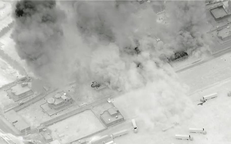 This screenshot from a U.S. military video shows airstrikes conducted Sunday, June 27, 2021, near the border between Iraq and Syria.