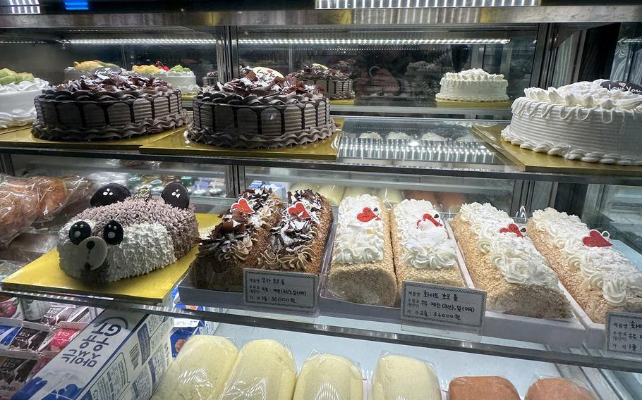 Sweet bakery pastries sit in a display case.