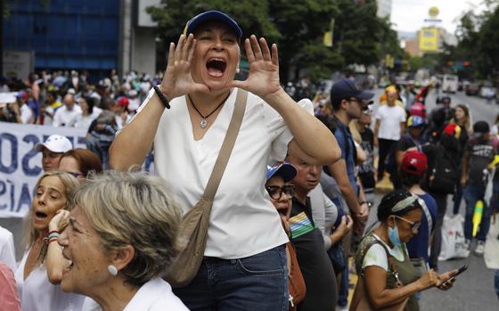 Opposition supporters protest the reelection of President Nicolás Maduro one month after the disputed vote, which opposition leaders claim they won by a landslide, in Caracas, Venezuela, Wednesday, Aug. 28, 2024. (AP Photo/Cristian Hernandez)