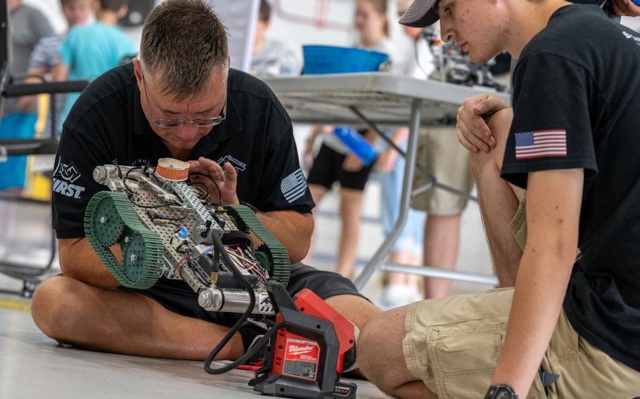 A local high school student works with a volunteer during the 2024 Wings Over Whiteman STEM Fest at Whiteman Air Force Base, Mo., July 12, 2024.