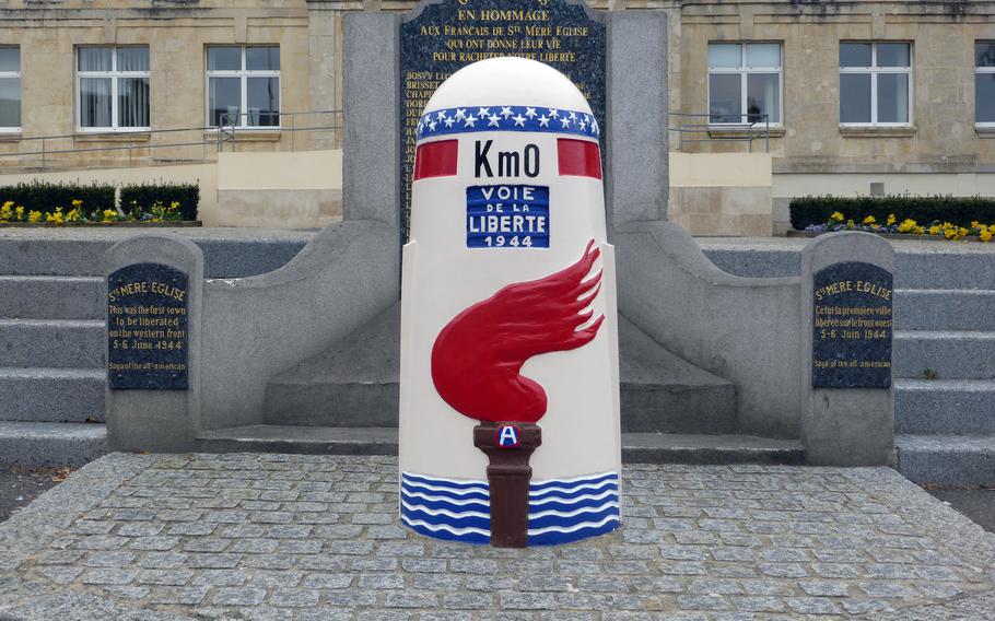 A post marking Kilometer 0 of the Voie  de la Liberté, or Liberty Road, stands in front of the Sainte-Mère-Église town hall. The route follows the Americans’ drive across France to liberate the country in World War II. Interestingly, there is a Kilometer 00 marker at Utah Beach, as well.