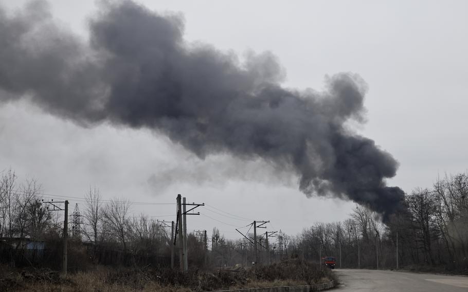 Smoke rises from an energy facility