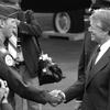 RHEIN-MAIN AB, Germany, July 16, 1978 — President Carter made a quick stop at the air base here where he left Air Force One and joined a motorcade heading to Wiesbaden Air Base. President Carter shakes hands with Maj. David H. Love, F-111 instructor pilot and aircraft commander, at Rhein-Main Air Base. Love said earlier that he was "very proud" to get his plane "polished up" as part of a static display of aircraft for the president.