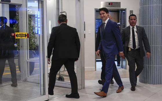 Canadian Prime Minister Justin Trudeau walks through the lobby of the Delta Hotel by Marriott, Friday, Nov. 29, 2024, in West Palm Beach, Fla. (AP Photo/Carolyn Kaster)