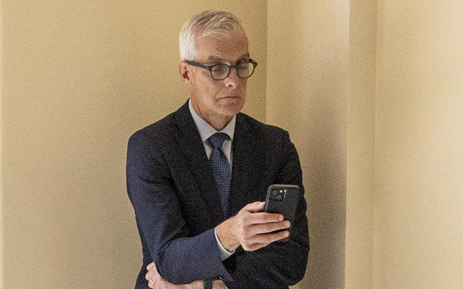 Department of Veterans Affairs Secretary Denis McDonough looks at his phone during a recess in a House Veterans’ Affairs Committee hearing on June 4, 2024.