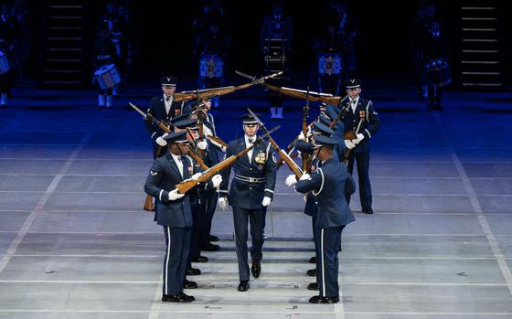 The United States Air Force Honor Guard Drill Team from Joint Base Anacostia-Bolling, Washington, D.C., displays their precision drill maneuvers before hundreds of spectators at the Virginia International Tattoo in Norfolk, Virginia, April 21, 2024. The drill team performed alongside other military performers from across the world. (U.S. Air Force photo by Senior Airman Taryn Onyon)