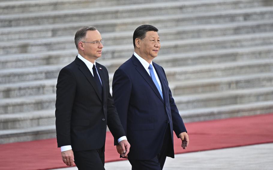 Chinese President Xi Jinping, right and Poland’s President Andrzej Duda attend the welcome ceremony at the Great Hall of the People in Beijing, Monday, June 24, 2024. 