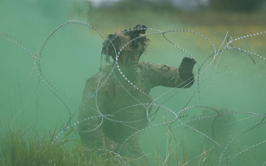 A soldier with the 101st Airborne Division participates in an air assault demonstration in Carentan, France, June 2, 2024. 