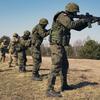 U.S. paratroopers assigned to the 3rd Brigade Combat Team, 82nd Airborne Division, and Polish soldiers engage targets during training in Nowa Deba, Poland, March 15, 2022. Poland expects to spend $200 million on upgrades for military bases used by U.S. forces during the next year.