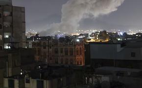 Smoke rises from a location reportedly struck by U.S. airstrikes in Sanaa, Yemen, Saturday, March 15, 2025. (AP Photo/Osamah Abdulrahman)