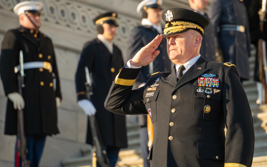 An Army general salutes on the steps of the Capitol.