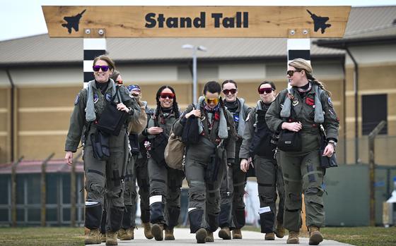 An all-female F-15E Strike Eagle aircrew steps to the flight line in observation of Women’s History Month at Royal Air Force Lakenheath, England, on March 22, 2021. MUST CREDIT: Senior Airman Madeline Herzog/48th Fighter Wing Public Affairs