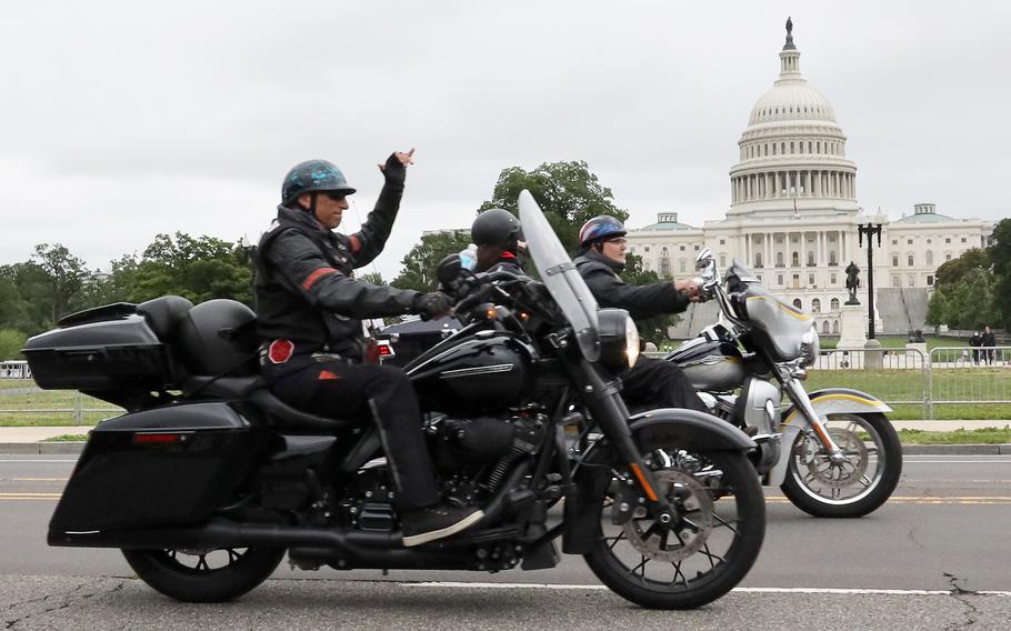 Motorcyclists taking part in the Rolling to Remember ride through Washington, D.C. pass the U.S. Capitol on May 30, 2021.
