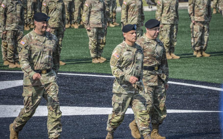 From left , Maj. Gen. William Taylor, outgoing 2nd Infantry Division commander, Lt. Gen. Christopher LaNeve, 8th Army commander, and Maj. Gen. Charles Lombardo, incoming 2nd ID commander, at the division change of command at Camp Humphreys, South Korea, on June 21, 2024. 