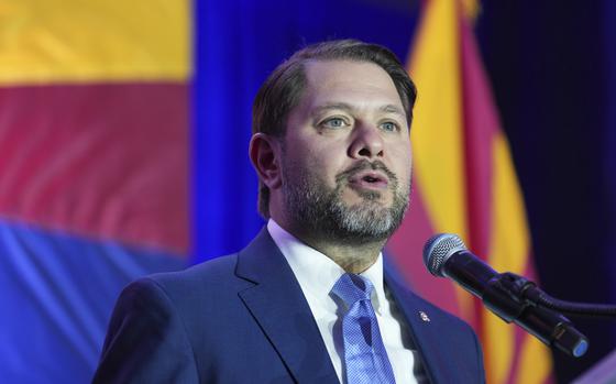 Ruben Gallego speaks into a microphone.