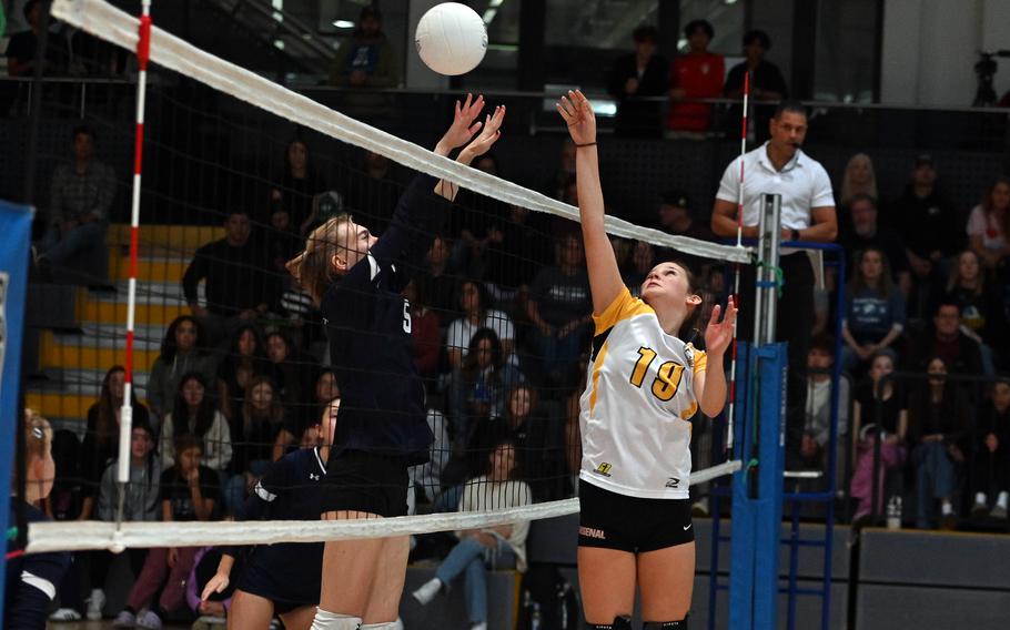 Mischa Robinson and Emily Bell battle for the ball.