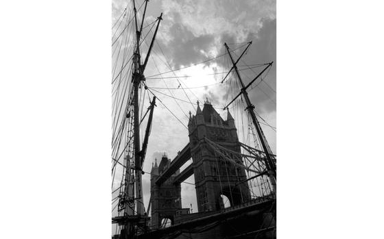 London, England, August, 1983: London's Tower Bridge, framed by the rigging of an old sailing ship on the Thames. 

Looking for places to travel and things to see while stationed in Europe? Check out Stars and Stripes' Travel section! https://www.stripes.com/living/europe_travel/

META TAGS: vacation; tourism; R&R; military family