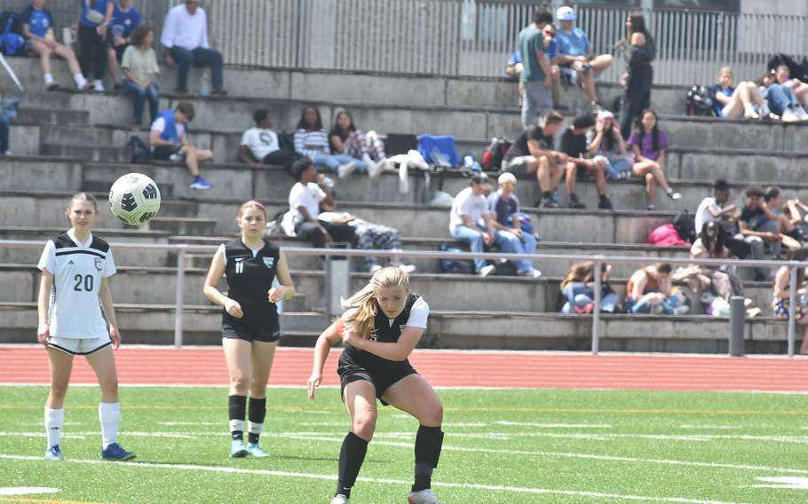 Stuttgart's Eva Eaton looks like she's trying to mentally guide a shot into the goal Monday, May 20, 2024 at the opening day of the DODEA European Division I girls soccer championships at Ramstein Air Base, Germany.