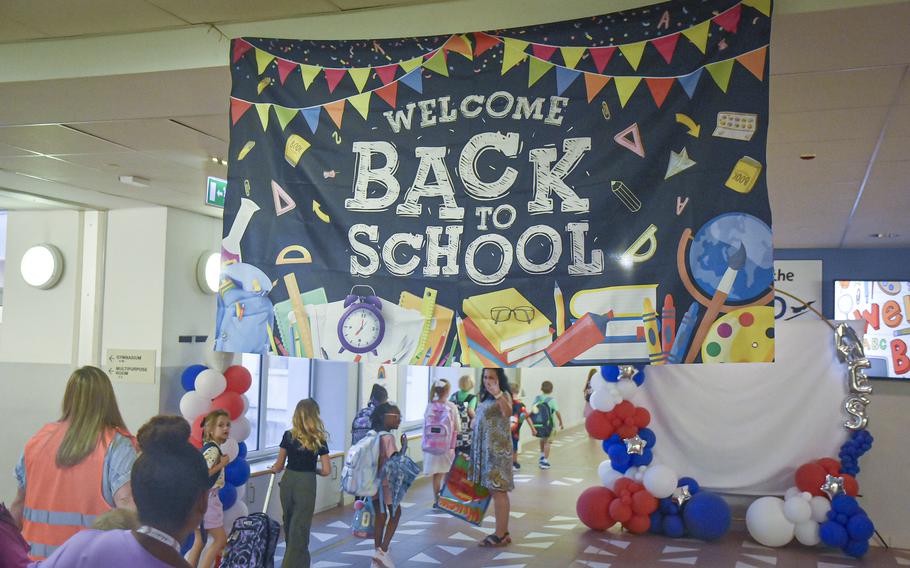 Students walk toward classrooms at Aviano Elementary School in Italy on Aug. 19, 2024.