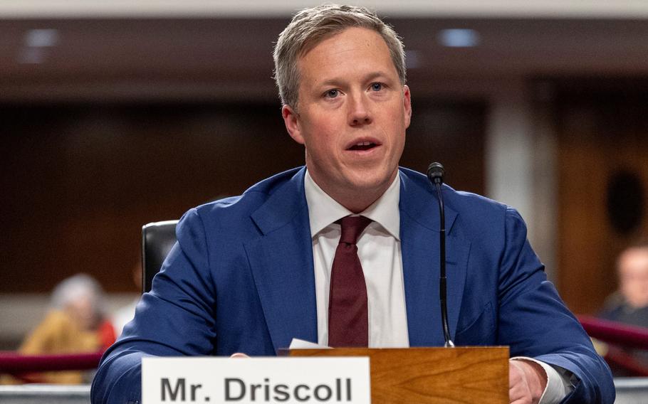 Driscoll seated, addressing senators during a hearing.