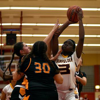 Bella Anku shoots the ball.