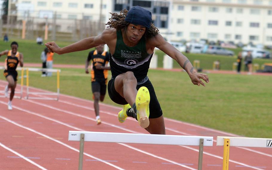 Kubasaki's Carlos Cadet navigates the 300 hurdles during Friday's first day of a two-day Okinawa track and field meet. Cadet won the event in 42.58 seconds.