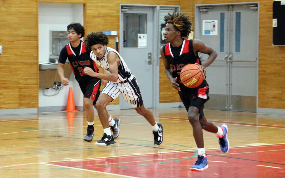 Jeremy Phillips heads up the court with the ball.