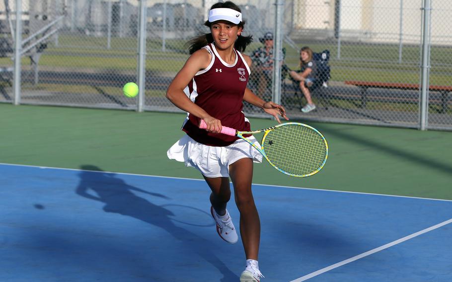 Matthew C. Perry's Nina Altig runs down the ball during this weekend's DODEA-Japan tennis matches. Altig teamed with Julie Apperson to win her doubles match against  E.J. King.