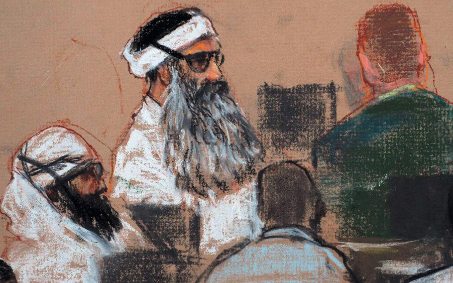 A courtroom sketch shows Khalid Sheikh Mohammed dressed in white with a long gray beard.