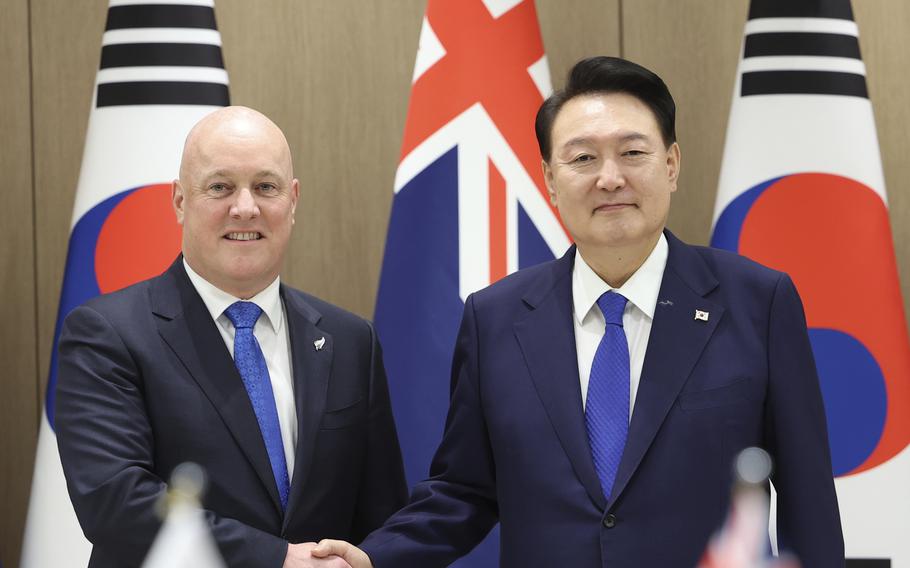 South Korean President Yoon Suk Yeol, right, shakes hands with New Zealand's Prime Minister Christopher Luxon during a meeting at the Presidential Office in Seoul, South Korea, Wednesday, Sept. 4, 2024.