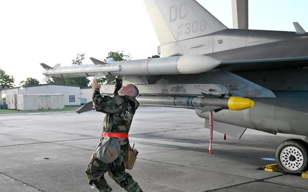 Members of the 113th Weapons Flight, D.C. Air National Guard, perform an early morning weapons inspection on an F-16 during an operational readiness exercise on Joint Base Andrews, Md., Sept. 8, 2024. (U.S. Air National Guard photo by Senior Master Sgt. Craig Clapper)