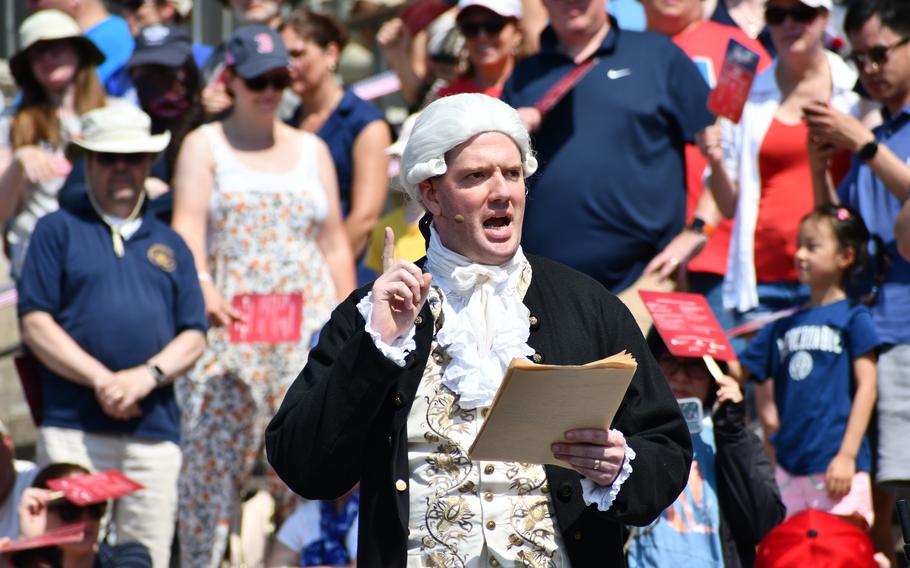 A reenactor portraying John Adams reads the Declaration of Independence on the steps of the National Archives on July 4, 2024.