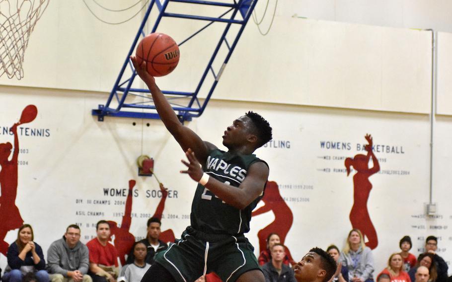 Ashton Jeanty flies through the air towards the basket.