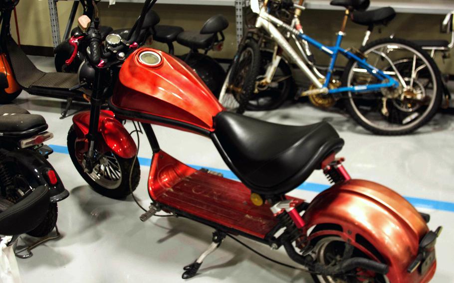 A powered scooter awaits repairs by volunteers with the Humphreys Bike Program at Camp Humphreys, South Korea, Sept. 12, 2023. 