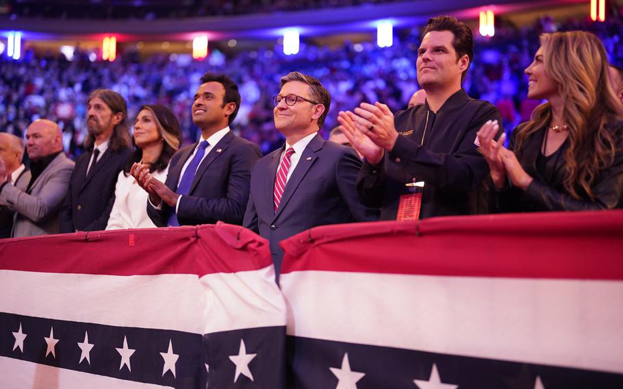 Mike Johnson smiles during a rally held by Donald Trump.