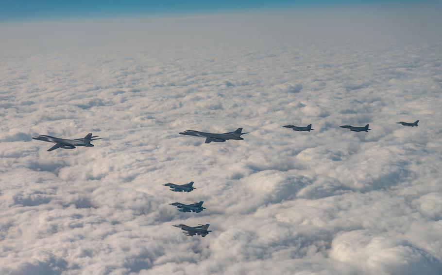 U.S. Air Force B-1B Lancers and F-16 Fighting Falcons fly alongside South Korean F-15Ks and Japanese F-2s during a trilateral air exercise near South Korea, Dec. 20, 2023.