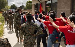 U.S. Marine Corps drill instructors with Marine Corps Recruit Depot San Diego hike with poolees and guests during an all-female pool function at Marine Corps Base Camp Pendleton, Calif., April 27. The pool function consisted of poolees and guests from Recruiting Station Riverside, RS San Diego and RS Orange County. (U.S. Marine Corps photo by Cpl. Fred Garcia)