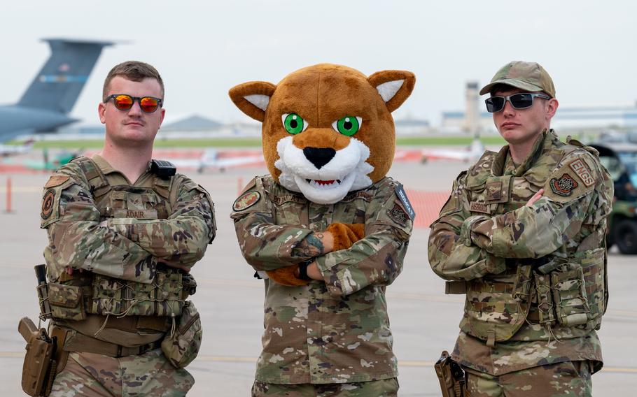 22nd Security Forces Squadron Airmen pose with McConnell air show mascot Duke Boomcat on Aug. 24 at McConnell Air Force Base, Kan. 