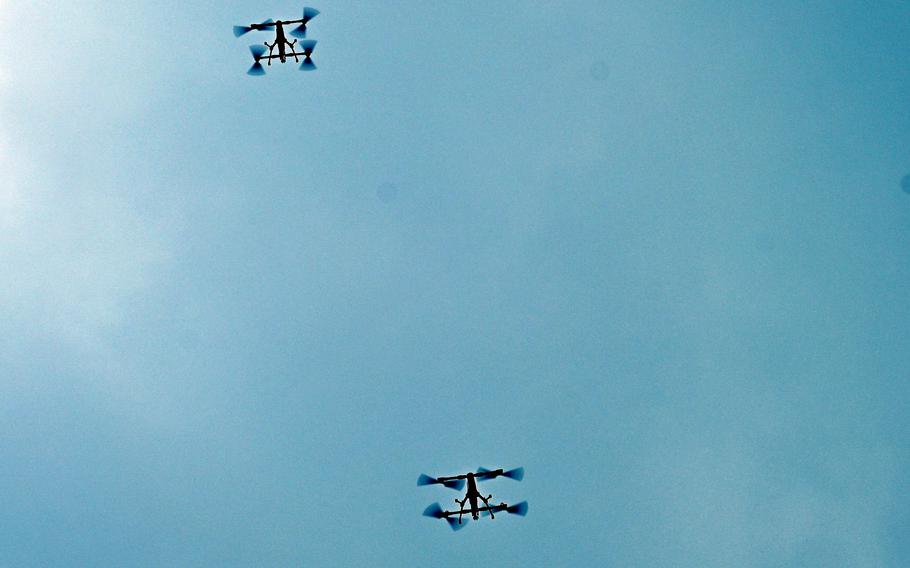 Drones swarm over U.S. and Thai soldiers.