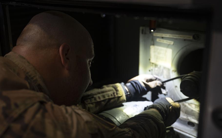 Staff Sgt. Justin Bosch of the 8th Civil Engineer Squadron replaces an air conditioning belt at Kunsan Air Base, South Korea, on Aug. 14, 2024.