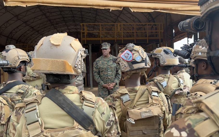 Marine Corps Gen. Michael Langley stands in front of a group of Somali service members in Mogadishu.