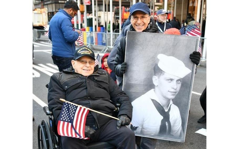 Navy veteran Arthur Grabiner and his son, Douglas Grabiner, at the New York City Veterans Day parade