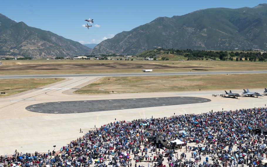 Crowds gather to watch an F-35A Lightning II fly side by side with a P-51 Mustang as part of a heritage flight at the Warriors over the Wasatch air show at Hill Air Force Base, Utah, June 29, 2024.