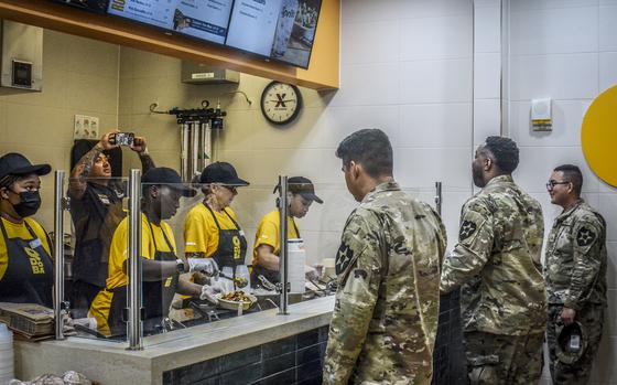 Soldiers line up for food outside the new Qdoba restaurant at Camp Humphreys, South Korea, Thursday, Sept. 12, 2024. 