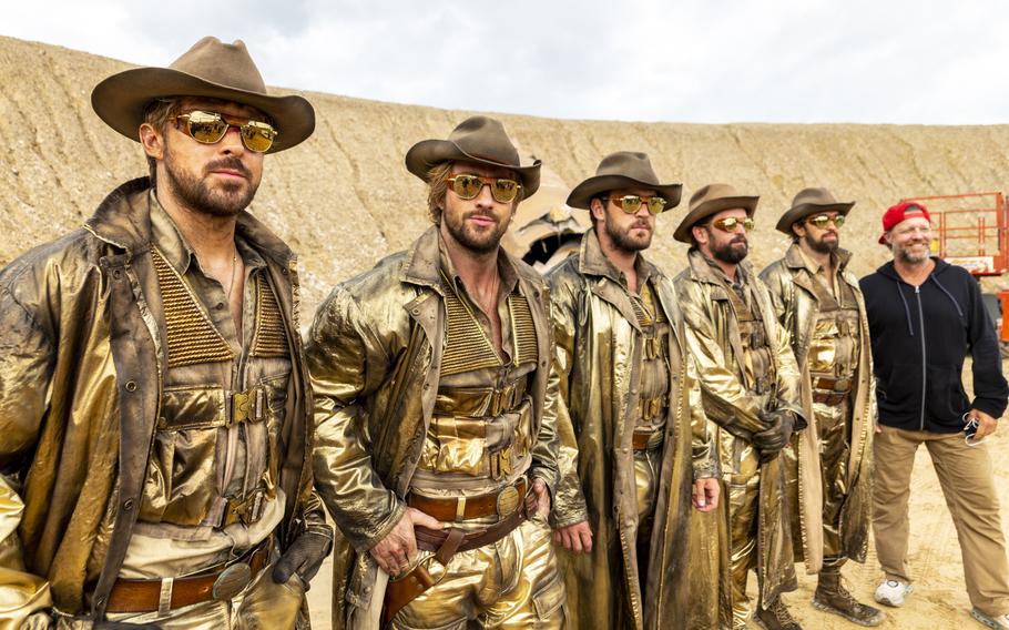 Fom left, Ryan Gosling and Aaron Taylor-Johnson, with stunt actors Ben Jenkin, Logan Holladay and Justin Eaton, posing with director David Leitch on the set of “The Fall Guy.” Jenkin and Holladay were just two of the five stuntmen who doubled as Gosling. 