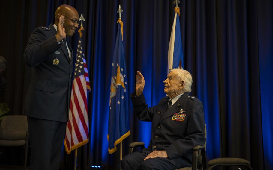 Air Force Chief of Staff Gen. CQ. Brown, Jr. administers the reaffirmation of the oath of office to retired Brig. Gen. Clarence E. “Bud” Anderson, during a ceremony promoting Anderson to the honorary rank of Brigadier General at the Aerospace Museum of California in McClellan, California, Dec. 2, 2022.