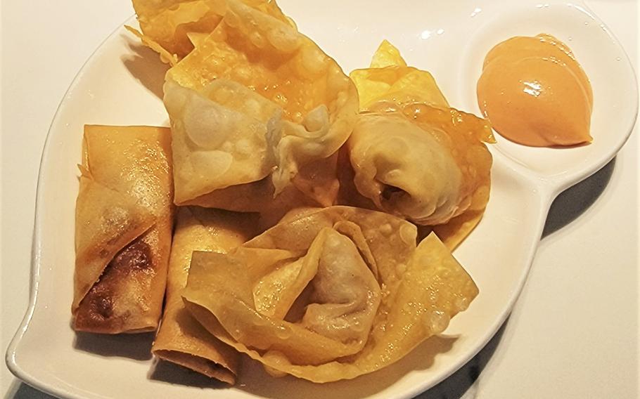 Fried spring rolls and minced meat wantons, from Kashima Sushi in Sacile, Italy. The restaurant offers an all-you-can-eat format for dine-in patrons.