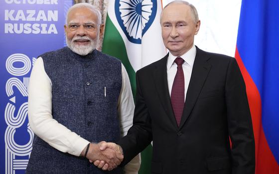 Russia's President Vladimir Putin meets with Indian Prime Minister Narendra Modi on the sidelines of the BRICS summit in Kazan on Oct. 22, 2024. (Alexander Zemlianichenko/Pool/AFP/Getty Images/TNS)