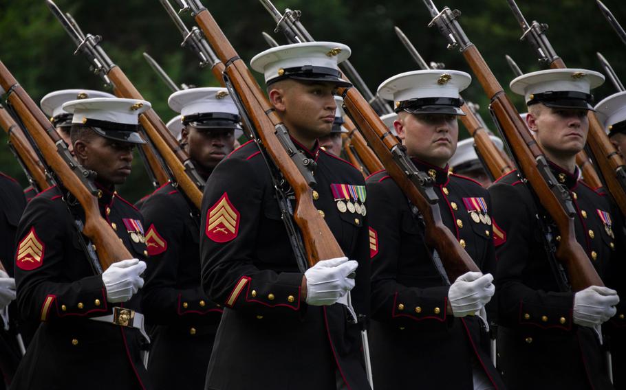 Marines with Bravo Company, Marine Barracks Washington, execute “eyes right” during a Sunset Parade at the Marine Corps War Memorial, Arlington, Va., July 23, 2024. 