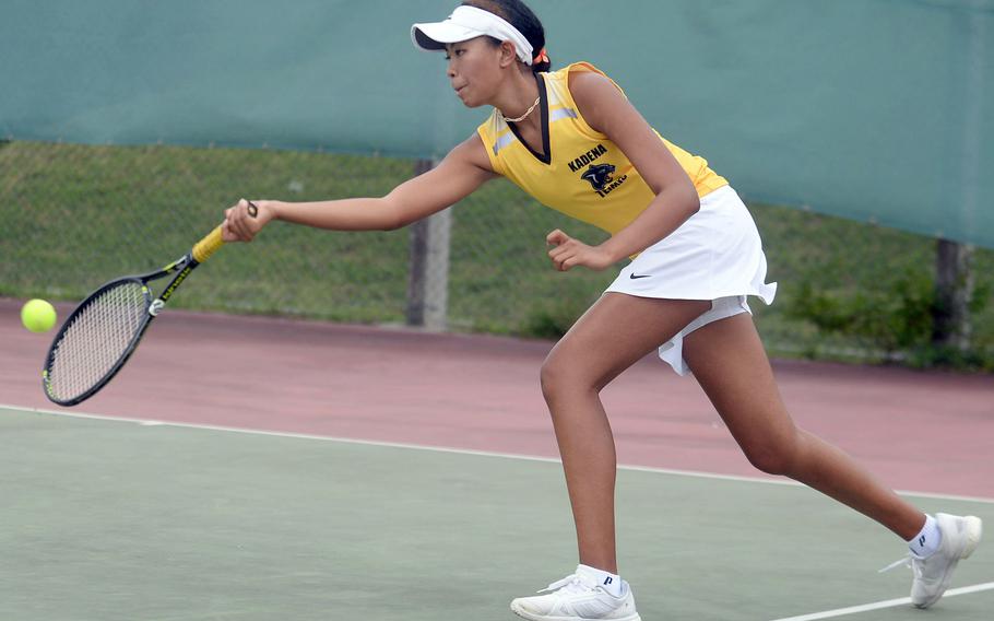 Kadena's Christine Ryan lunges to make a forehand return during Wednesday's Okinawa tennis doubles tournament. Ryan and teammate Mayann Rivera beat Kubasaki's Leanna Manuel and Noemi Ung 9-8 (7-1), and will play Kadena's Mary Tracy and Mady Small for the championship on Monday at Kadena.